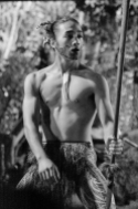 A young Maori man dancing